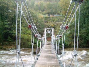 suspension bridge over flooded river